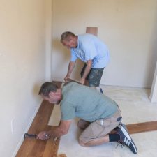 Shaun Powers and Hank fixing floor